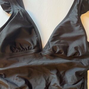 SIZE MEDIUM 8-10 BLACK ONE PIECE HALTER ON TOP AND HIGH CUT AT BOTTOM NWOT